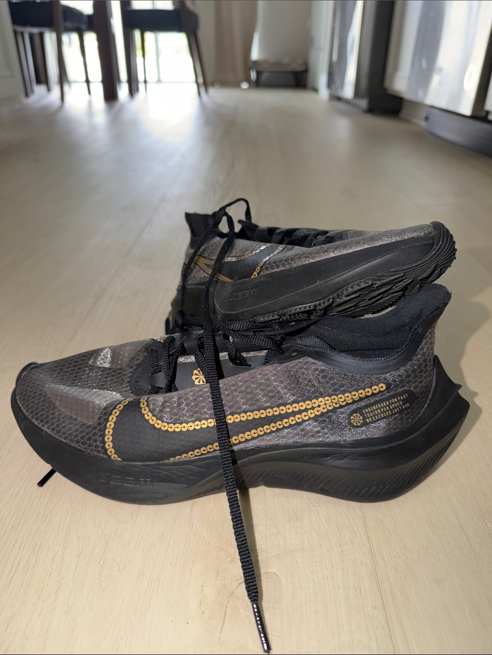 Nike ZoomX women’s  Black and Gold Running Shoes